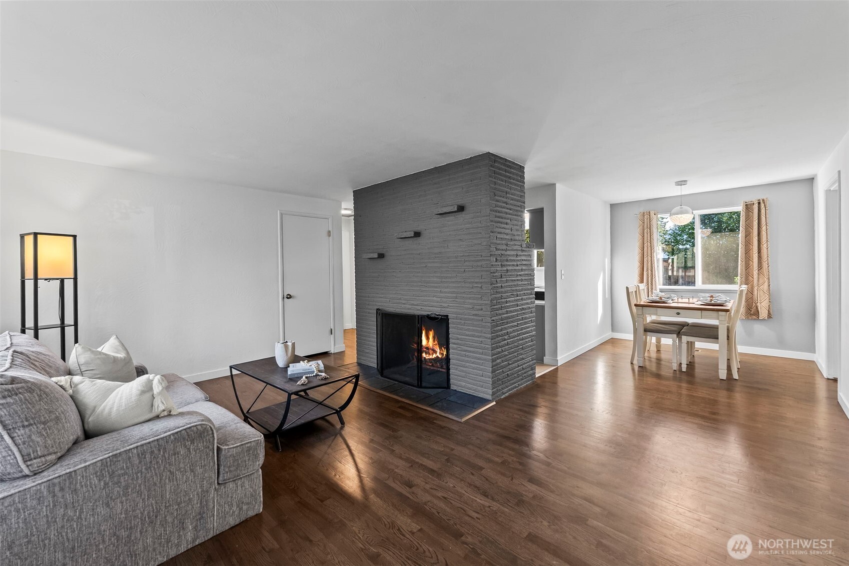 8809 Meadow Road Southwest Lakewood, WA 98499 - Photo 3 of 33 a living room with furniture and a fireplace