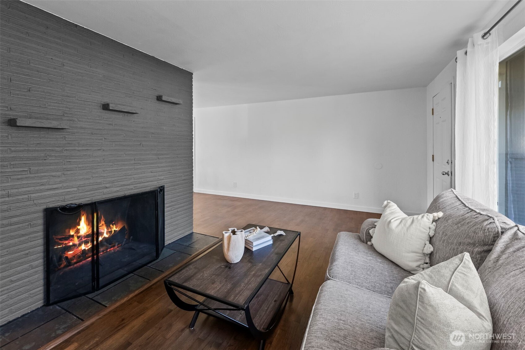 8809 Meadow Road Southwest Lakewood, WA 98499 - Photo 5 of 33 a living room with furniture and a fireplace