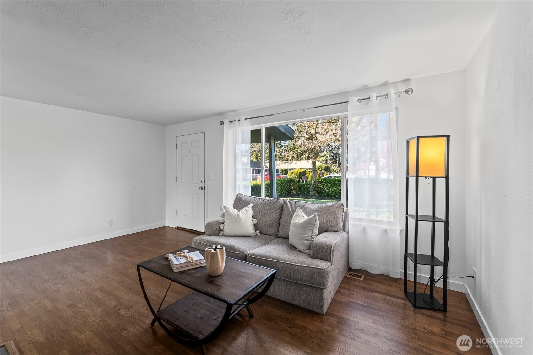 8809 Meadow Road Southwest Lakewood, WA 98499 - Photo 6 of 33 a living room with furniture and a large window
