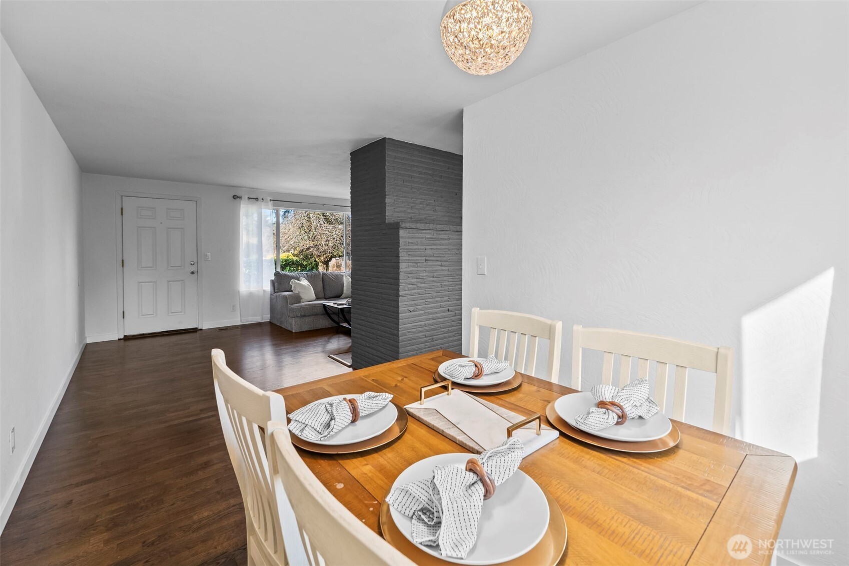 8809 Meadow Road Southwest Lakewood, WA 98499 - Photo 7 of 33 a dining room with furniture and wooden floor