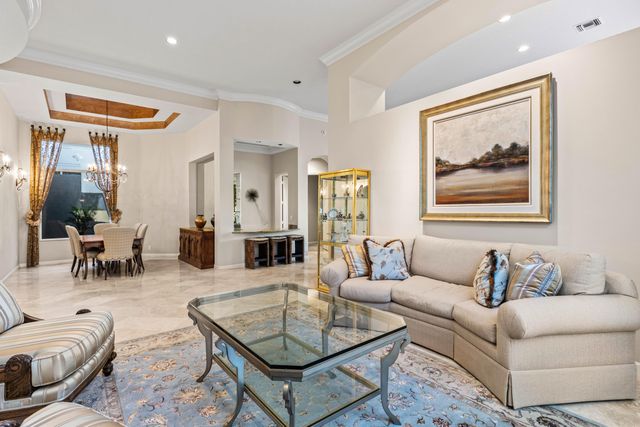 a bedroom with a bed dresser and a window