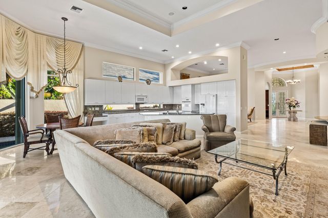 a bathroom with a double vanity sink a toilet a mirror and shower