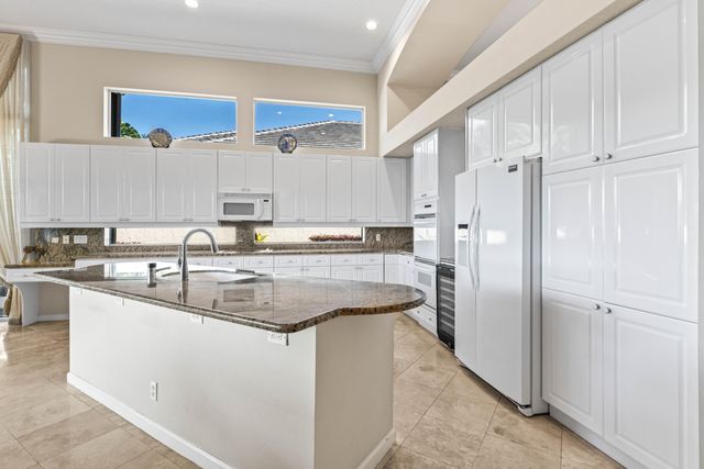 a living room with furniture a floor to ceiling window and couch