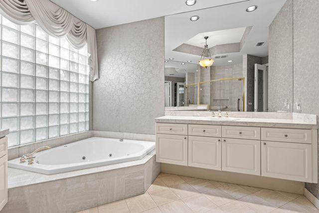 an aerial view of residential houses with outdoor space and street view