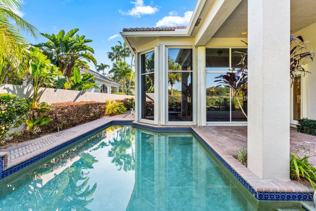 a view of a swimming pool with a patio