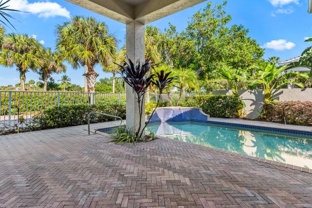 a view of a swimming pool with a yard