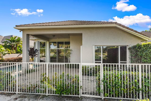 a view of living room with furniture and floor to ceiling window