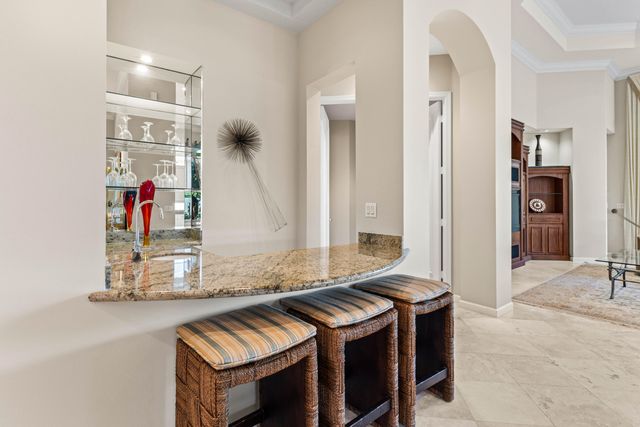 a kitchen with stainless steel appliances granite countertop a sink and a stove
