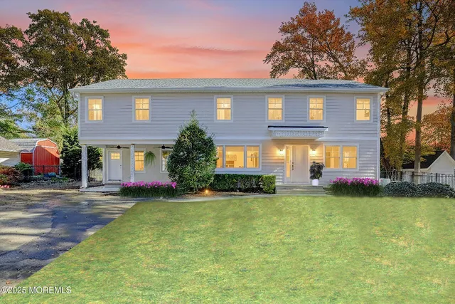 a view of a house with a yard porch and sitting area