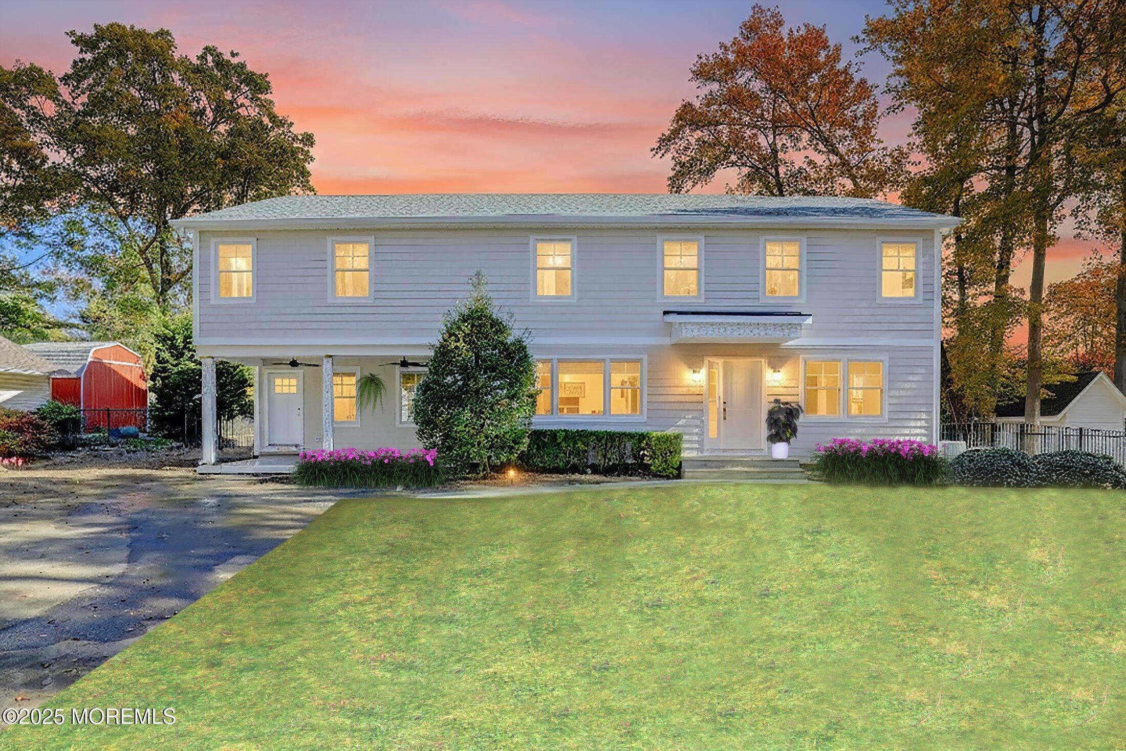 a view of a house with a yard porch and sitting area
