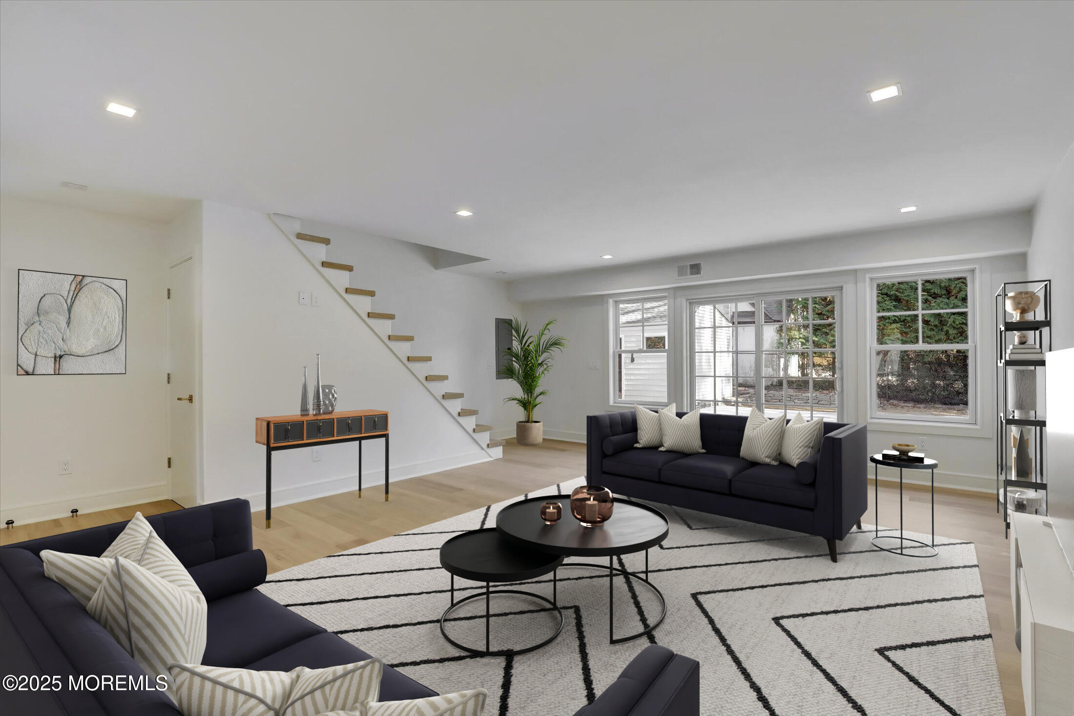 243 Woodcrest Road Oakhurst, NJ 07755 - Photo 12 of 42 a living room with furniture and wooden floor