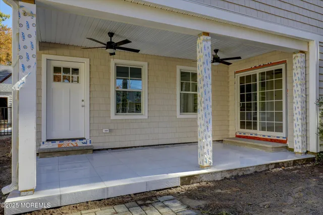 a view of a house with swimming pool and furniture