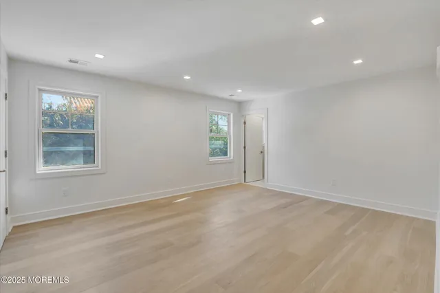 a picture of a bench in front of a wall