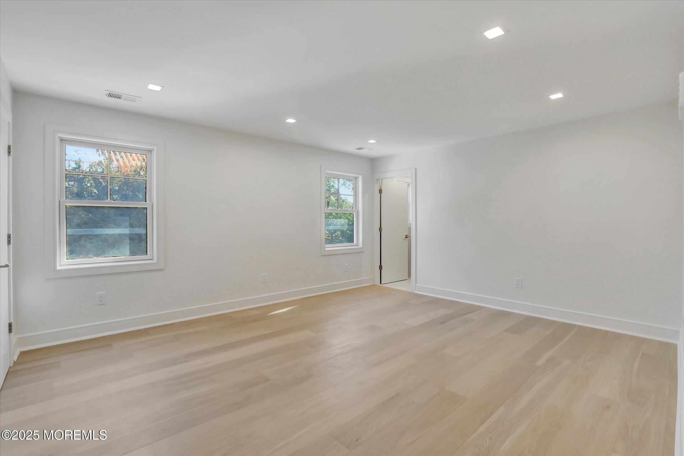 243 Woodcrest Road Oakhurst, NJ 07755 - Photo 22 of 42 an empty room with windows