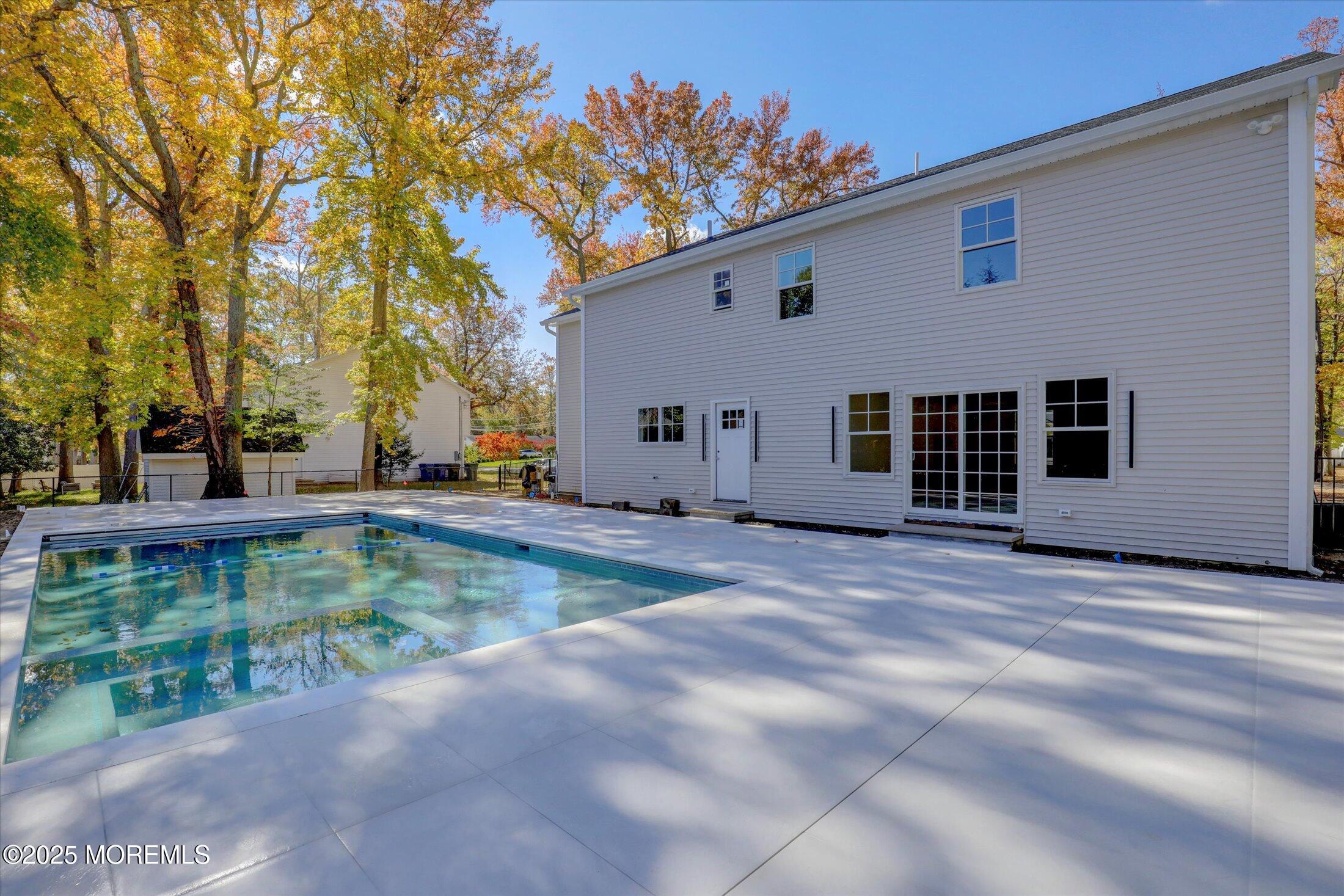 243 Woodcrest Road Oakhurst, NJ 07755 - Photo 6 of 42 a view of a house with a backyard