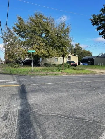 a view of green field with trees