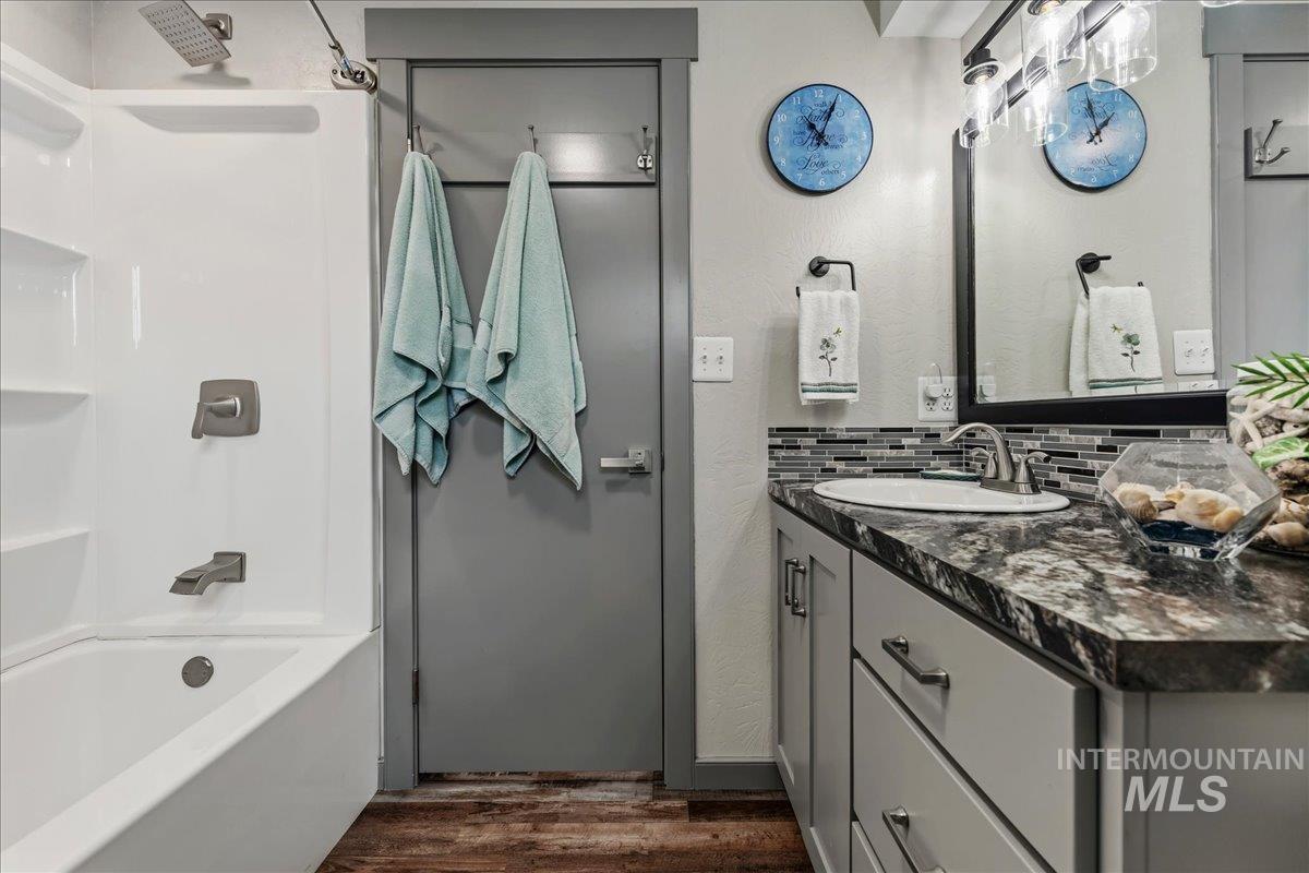 6323 Foothill Road Star, ID 83669 - Photo 26 of 50 Bathroom featuring a white tub/shower combination with a brushed nickel showerhead and faucet
