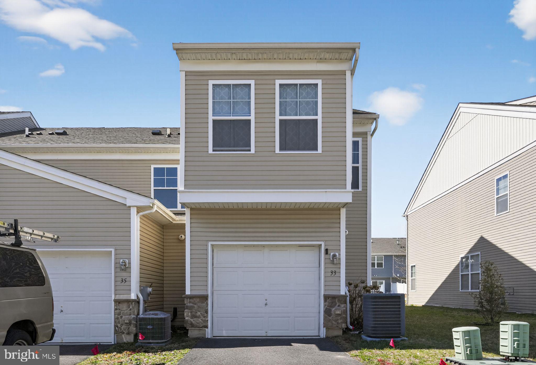 33 Rowand Way East Clementon, NJ 08021 - Photo 2 of 15 a front view of a house with a garage