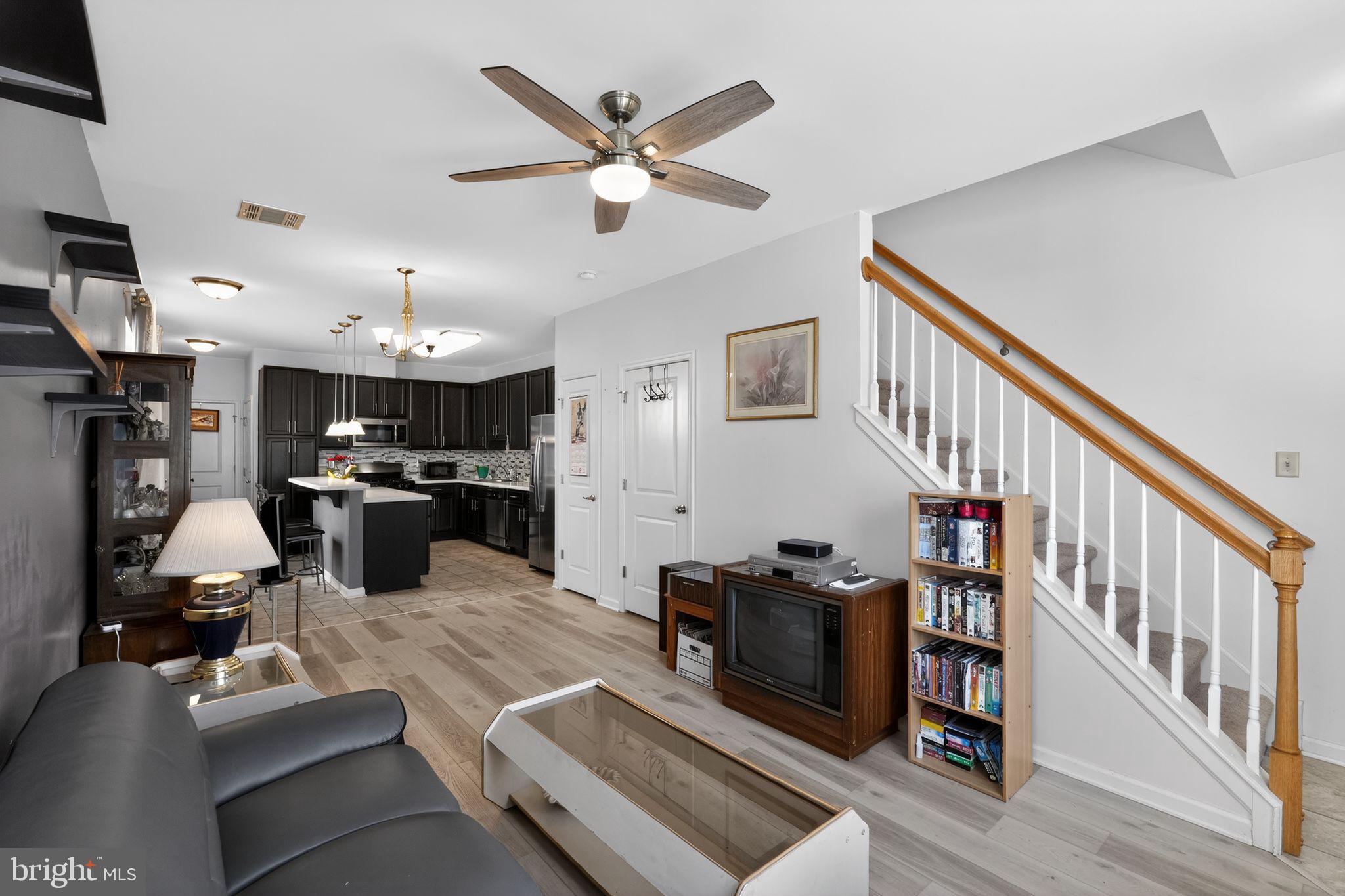 33 Rowand Way East Clementon, NJ 08021 - Photo 3 of 15 a living room with furniture kitchen view and a chandelier