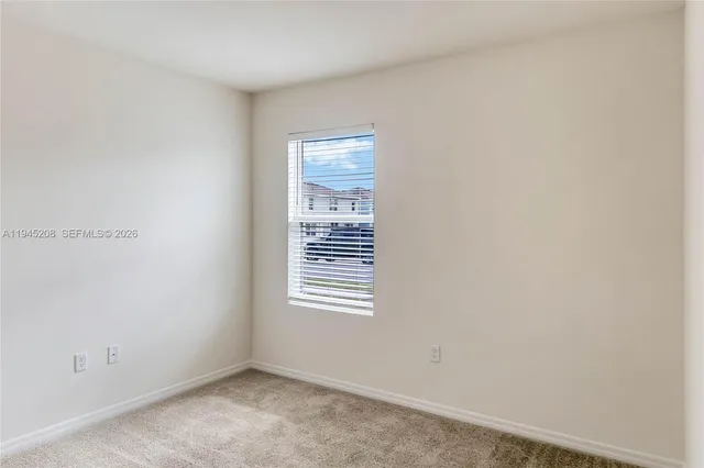 a view of a room that has a window in it