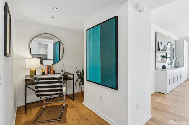 a view of living room and wooden floor