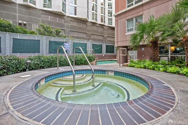 a view of a patio with dining table and chairs
