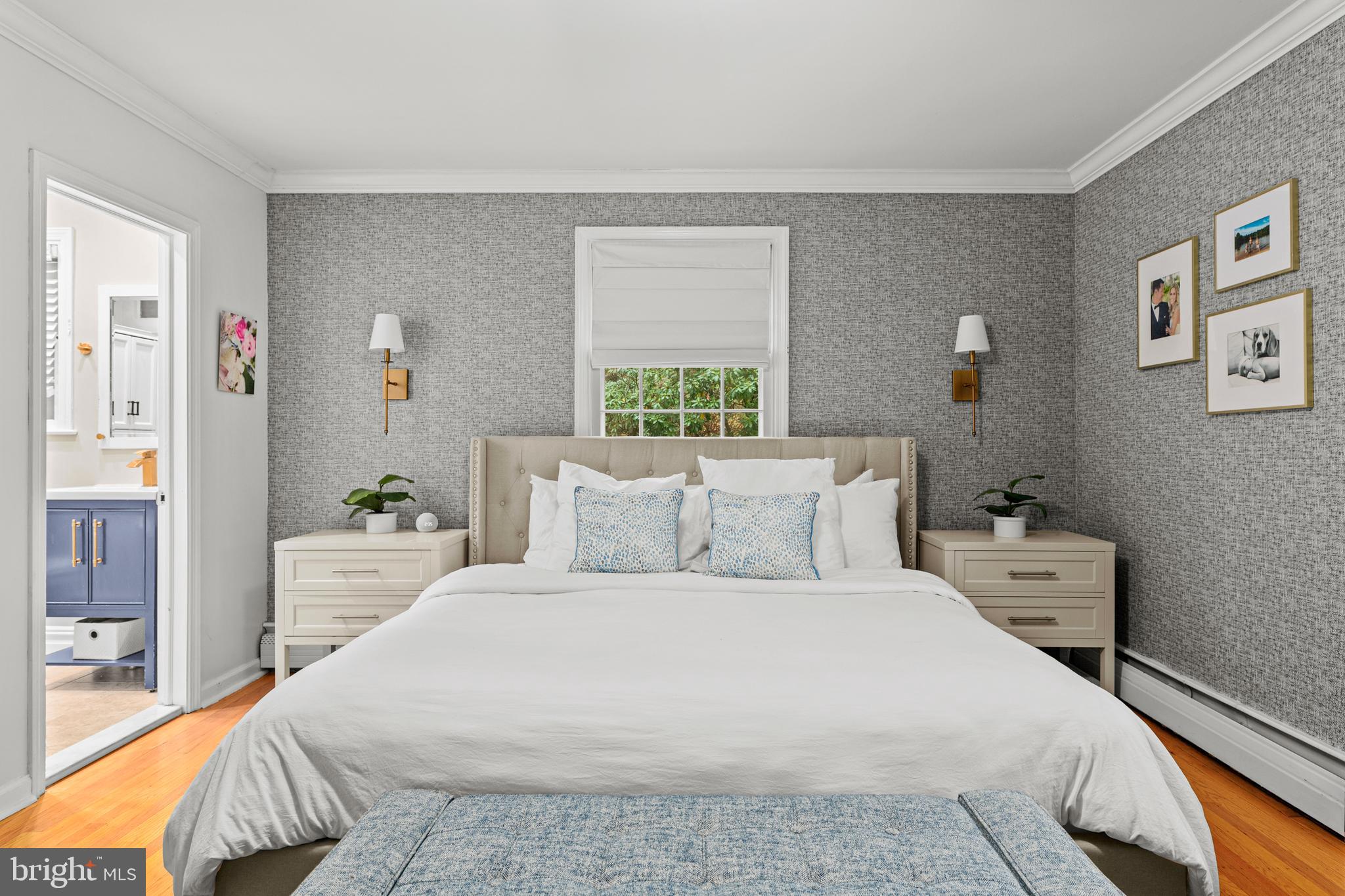 476 Upper Weadley Road Wayne, PA 19087 - Photo 21 of 45 a bedroom with a large bed and a chandelier