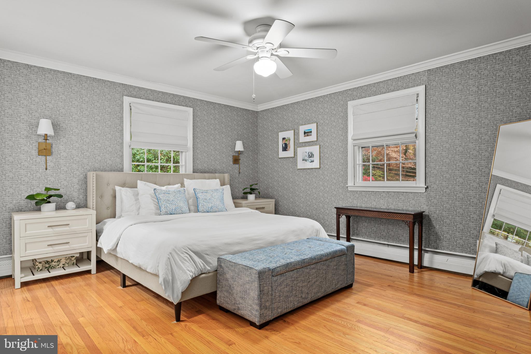 476 Upper Weadley Road Wayne, PA 19087 - Photo 22 of 45 a bedroom with a bed and a table in it