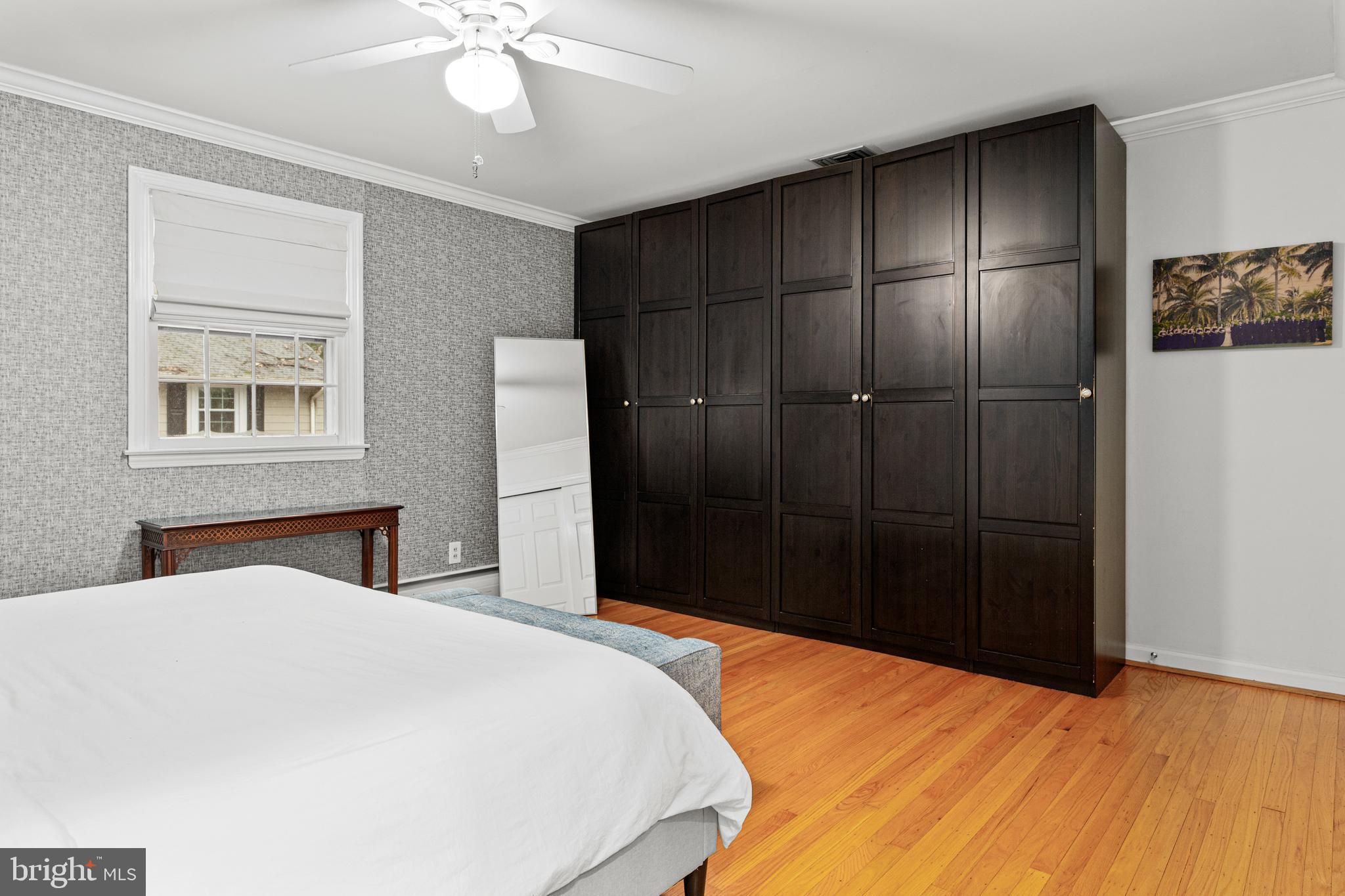 476 Upper Weadley Road Wayne, PA 19087 - Photo 23 of 45 a bedroom with a bed and a chandelier