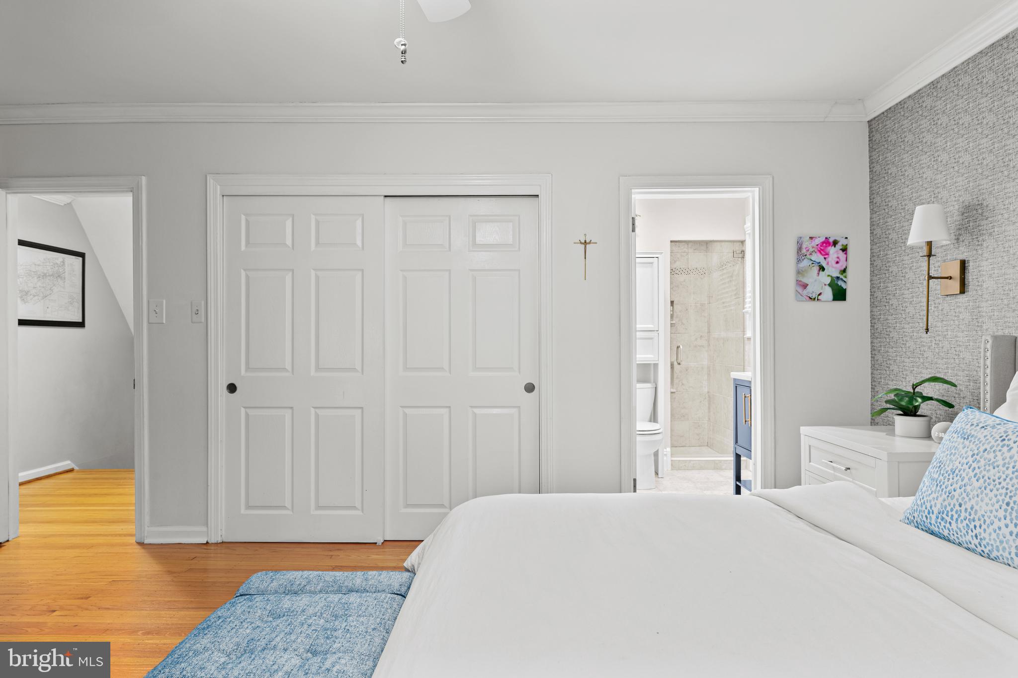 476 Upper Weadley Road Wayne, PA 19087 - Photo 24 of 45 a bedroom with a bed and painting on the wall