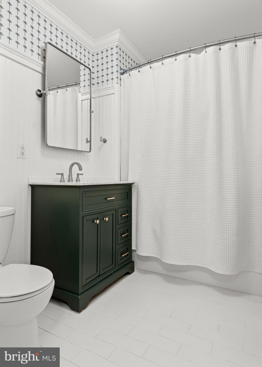 476 Upper Weadley Road Wayne, PA 19087 - Photo 27 of 45 a bathroom with a sink a toilet and mirror