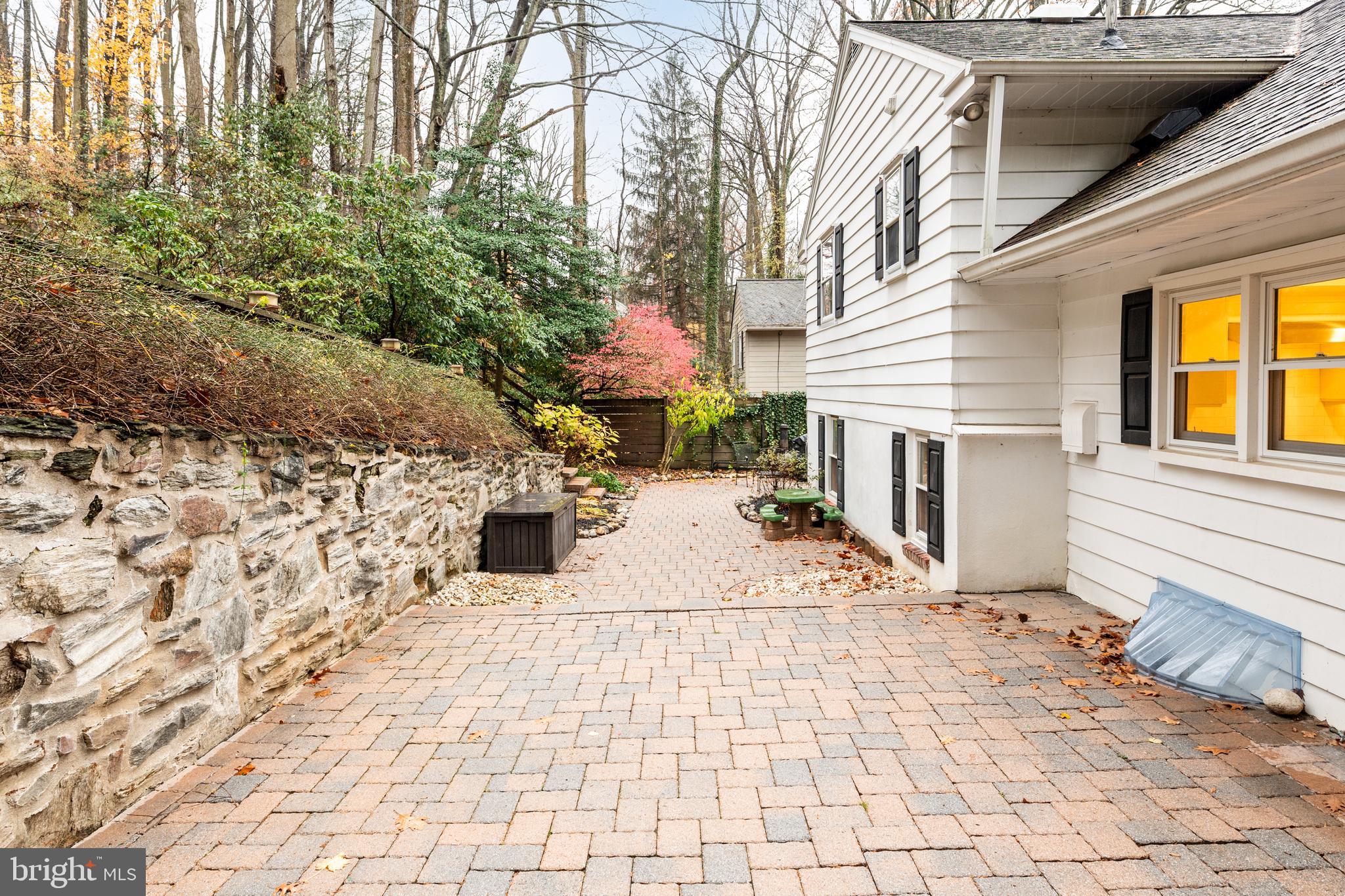 476 Upper Weadley Road Wayne, PA 19087 - Photo 42 of 45 a view of a terrace with a bench