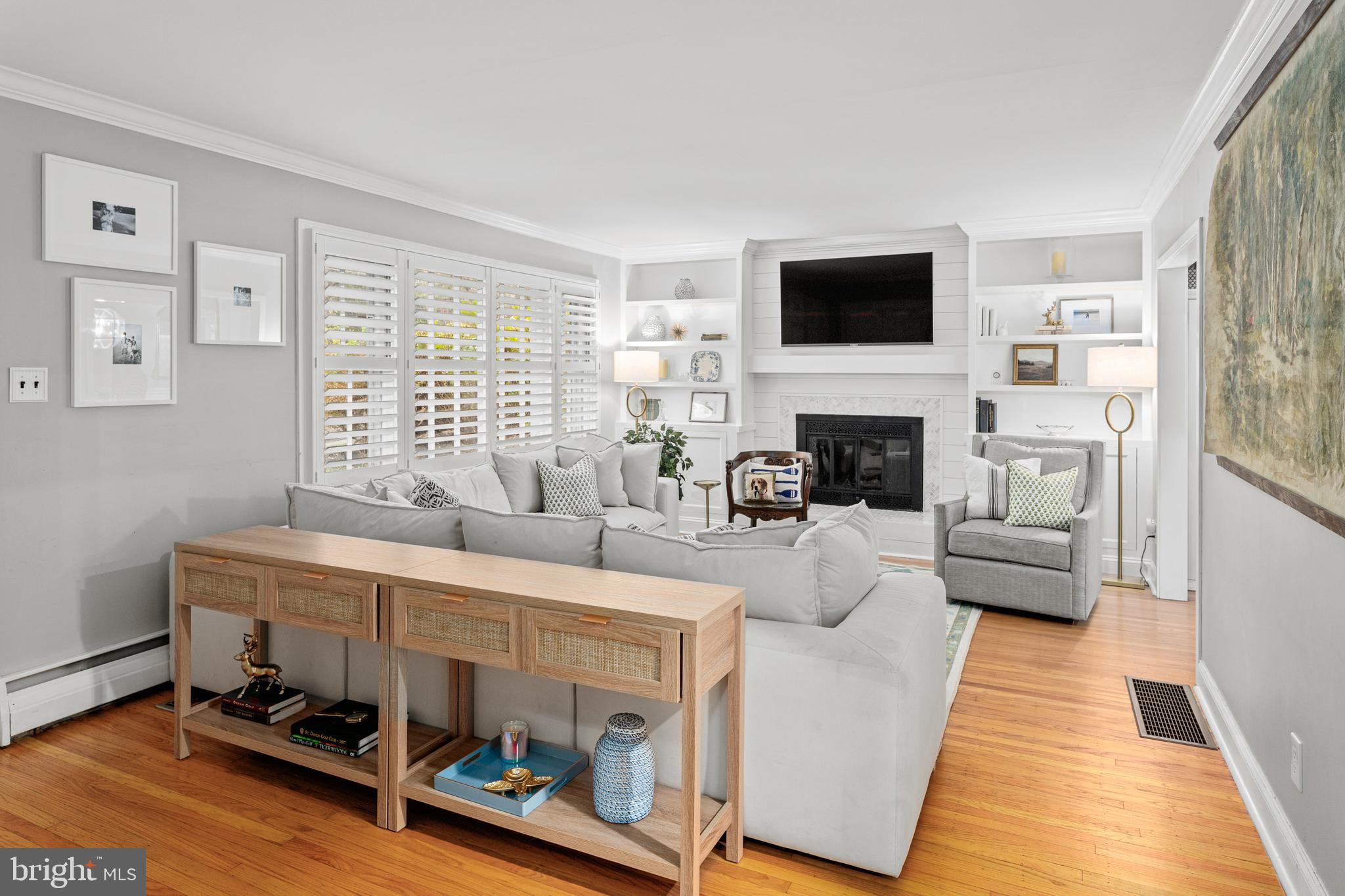 476 Upper Weadley Road Wayne, PA 19087 - Photo 7 of 45 a living room with furniture and a flat screen tv
