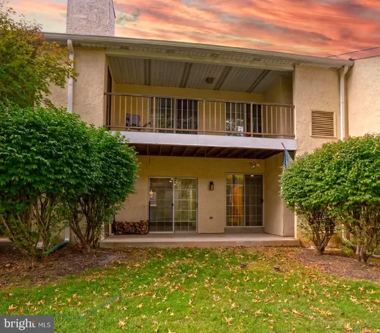 a view of a backyard with a tree