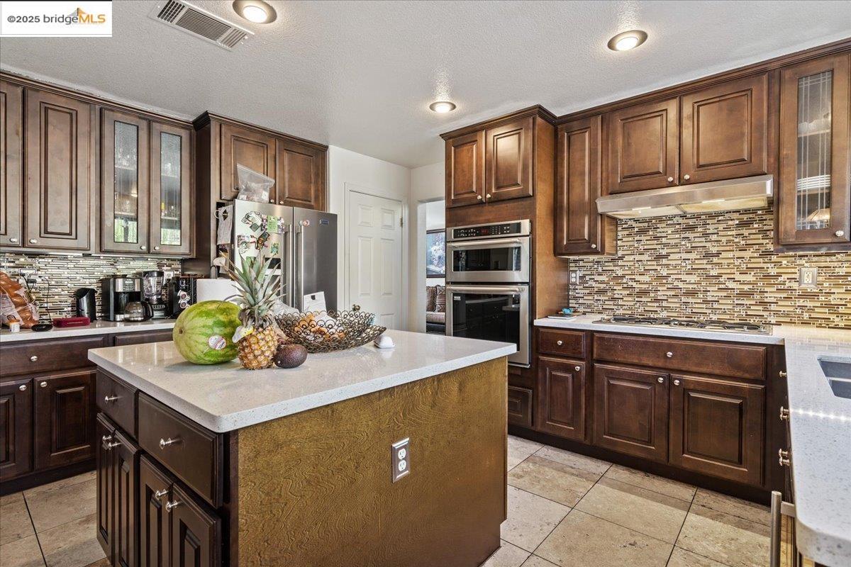 4137 Amargosa Drive Antioch, CA 94531 - Photo 12 of 31 a kitchen with a sink stove and cabinets