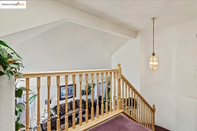 a view of hallway with wooden floor
