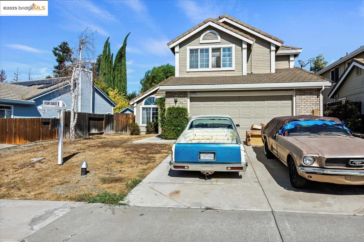 4137 Amargosa Drive Antioch, CA 94531 - Photo 2 of 31 a car parked in front of white house