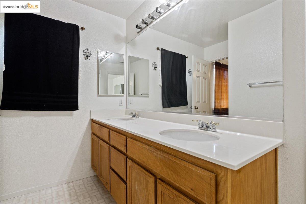 4137 Amargosa Drive Antioch, CA 94531 - Photo 26 of 31 a bathroom with a sink and a mirror