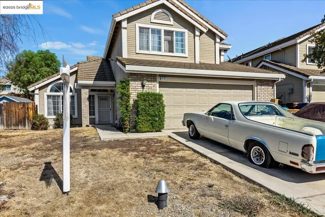 a car parked in front of a house