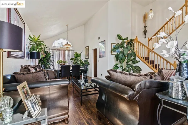 a living room with furniture fireplace and a flat screen tv
