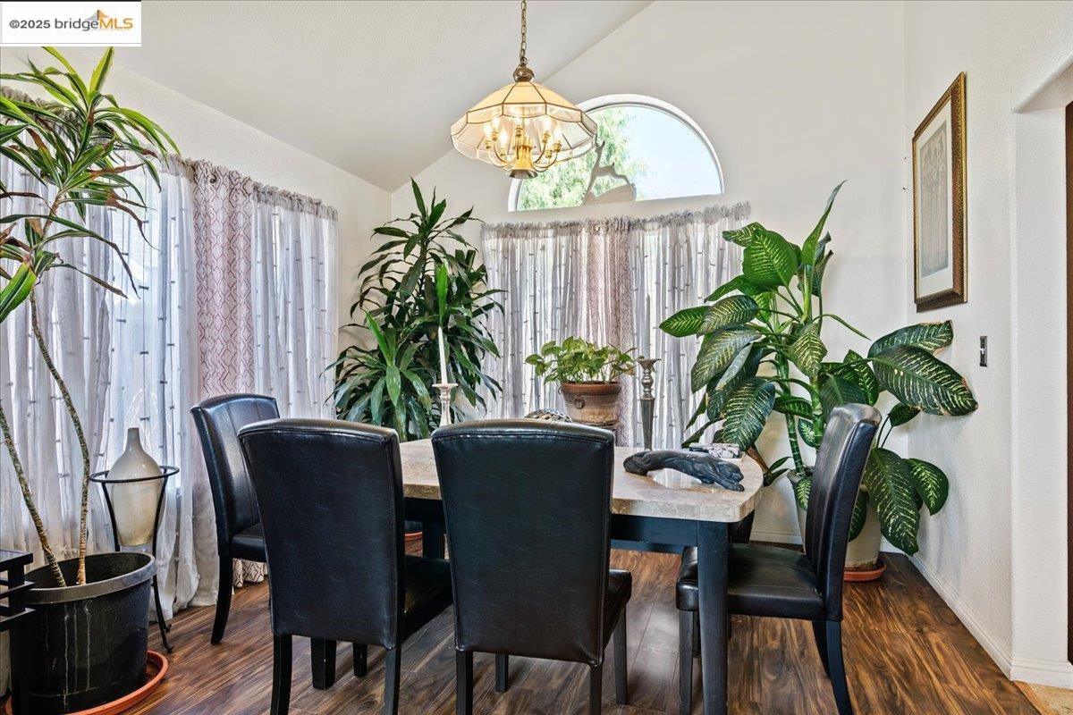 4137 Amargosa Drive Antioch, CA 94531 - Photo 10 of 31 a dining room with furniture a potted plant and a large mirror