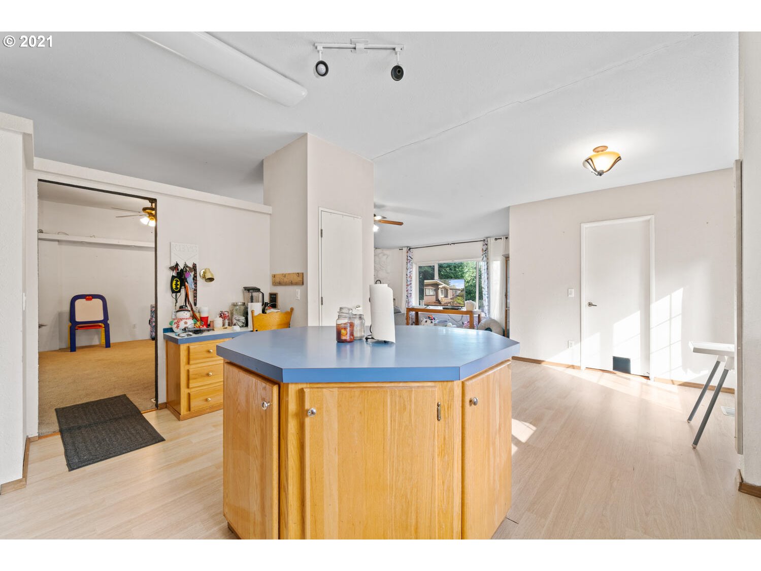 15639 South Fawn View Way Molalla, OR 97038 - Photo 4 of 11 a view of living room with kitchen island furniture and wooden floor