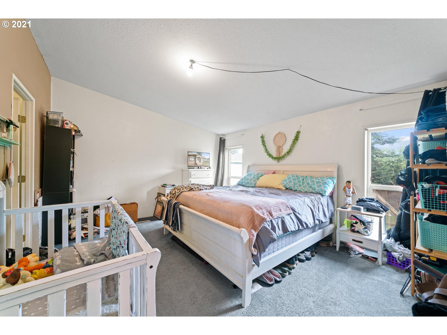 15639 South Fawn View Way Molalla, OR 97038 - Photo 7 of 11 a bedroom with a bed window and a flat screen tv