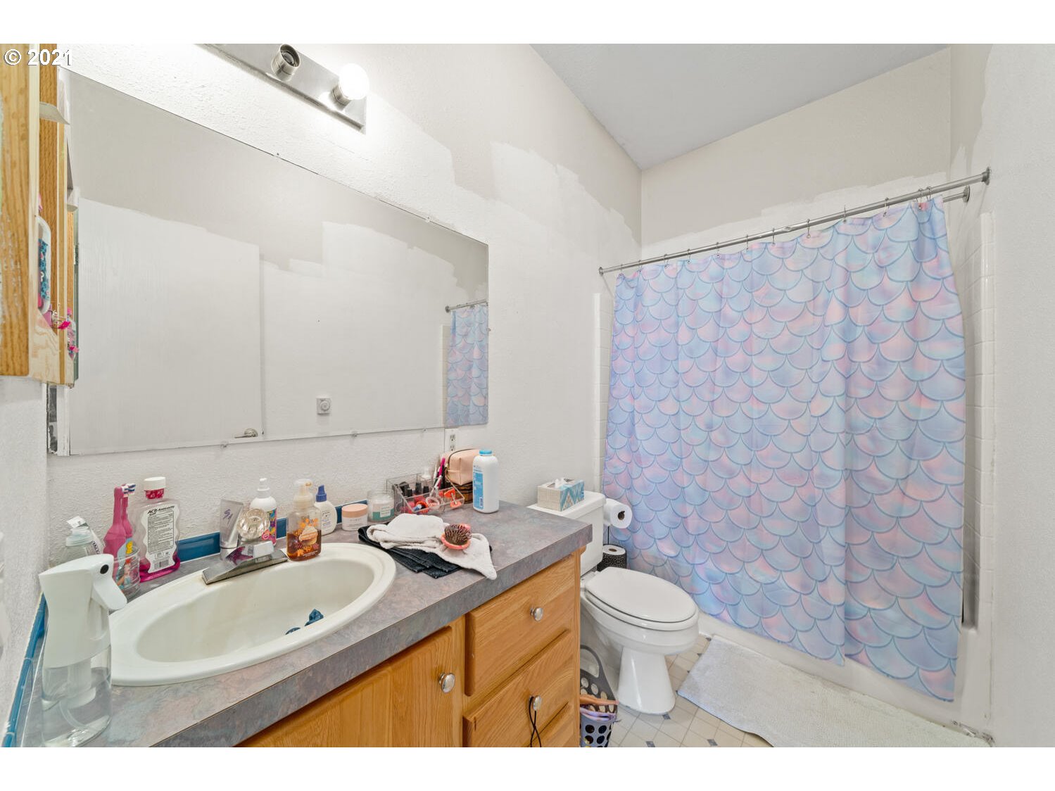 15639 South Fawn View Way Molalla, OR 97038 - Photo 10 of 11 a bathroom with a sink toilet vanity and shower