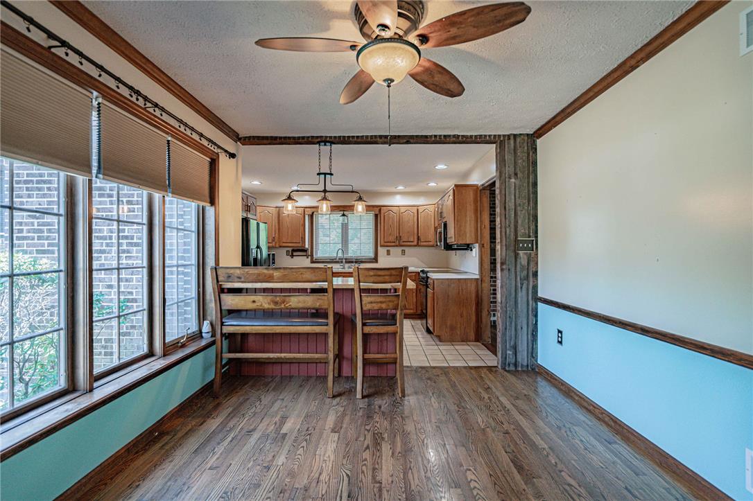 652 Old State Road Oley, PA 19547 - Photo 11 of 54 A spacious dining area seamlessly transitions into a well-appointed kitchen, ideal for entertaining.