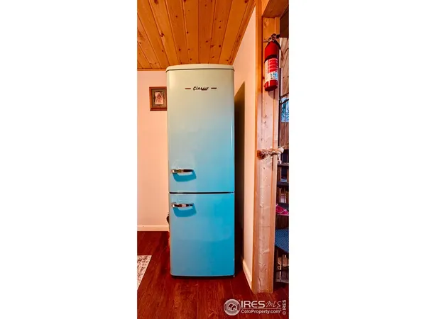 a bathroom with a shower and a mirror