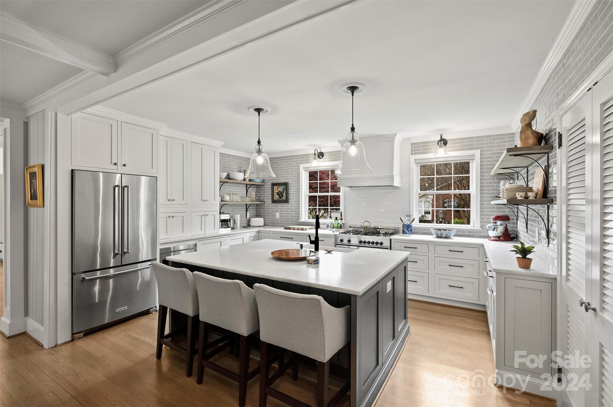 101 Sardis View Road Charlotte, NC 28211 - Photo 13 of 43 a kitchen with white cabinets and stainless steel appliances