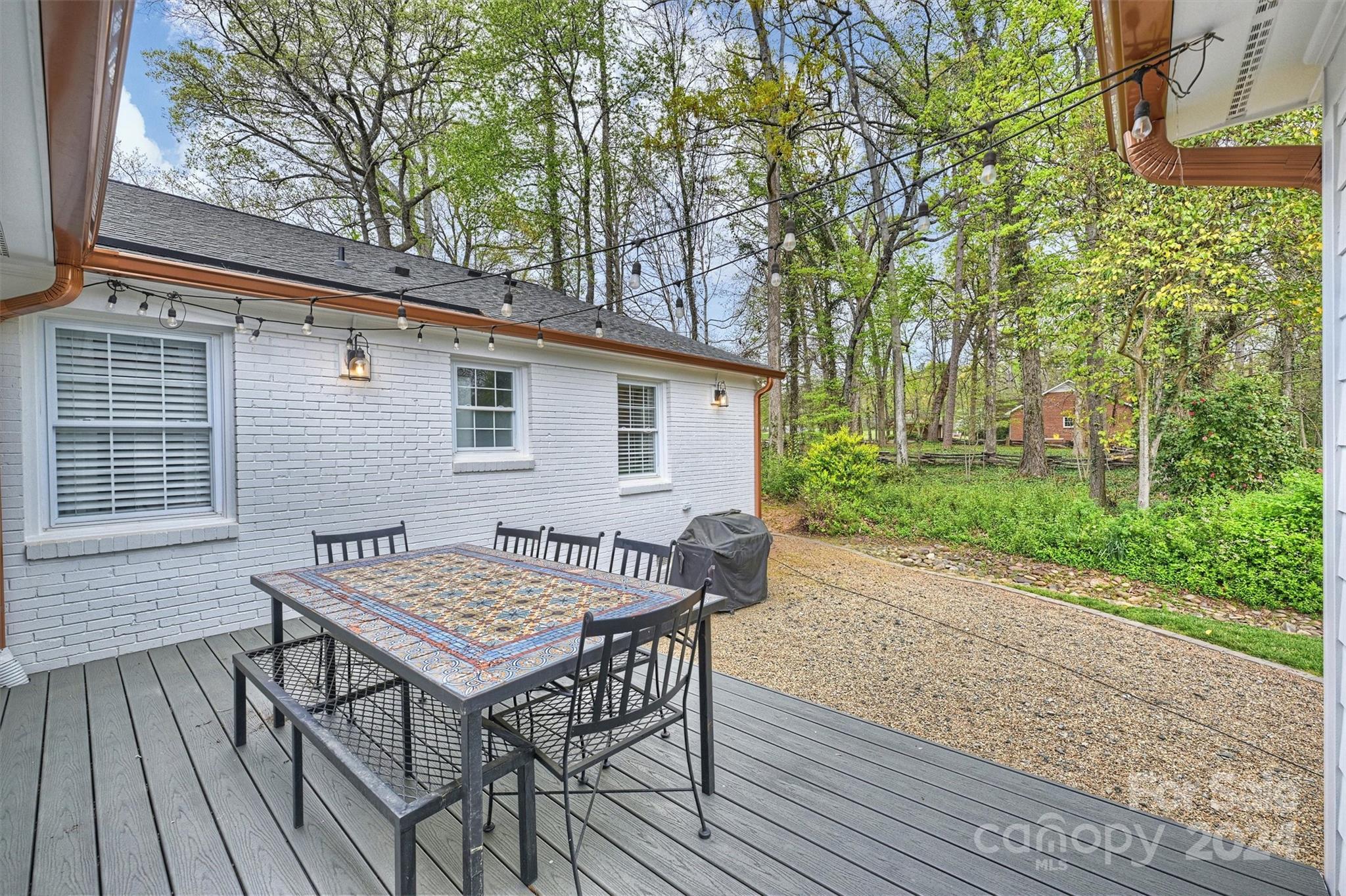 101 Sardis View Road Charlotte, NC 28211 - Photo 32 of 43 a backyard of a house with wooden floor yard and outdoor seating