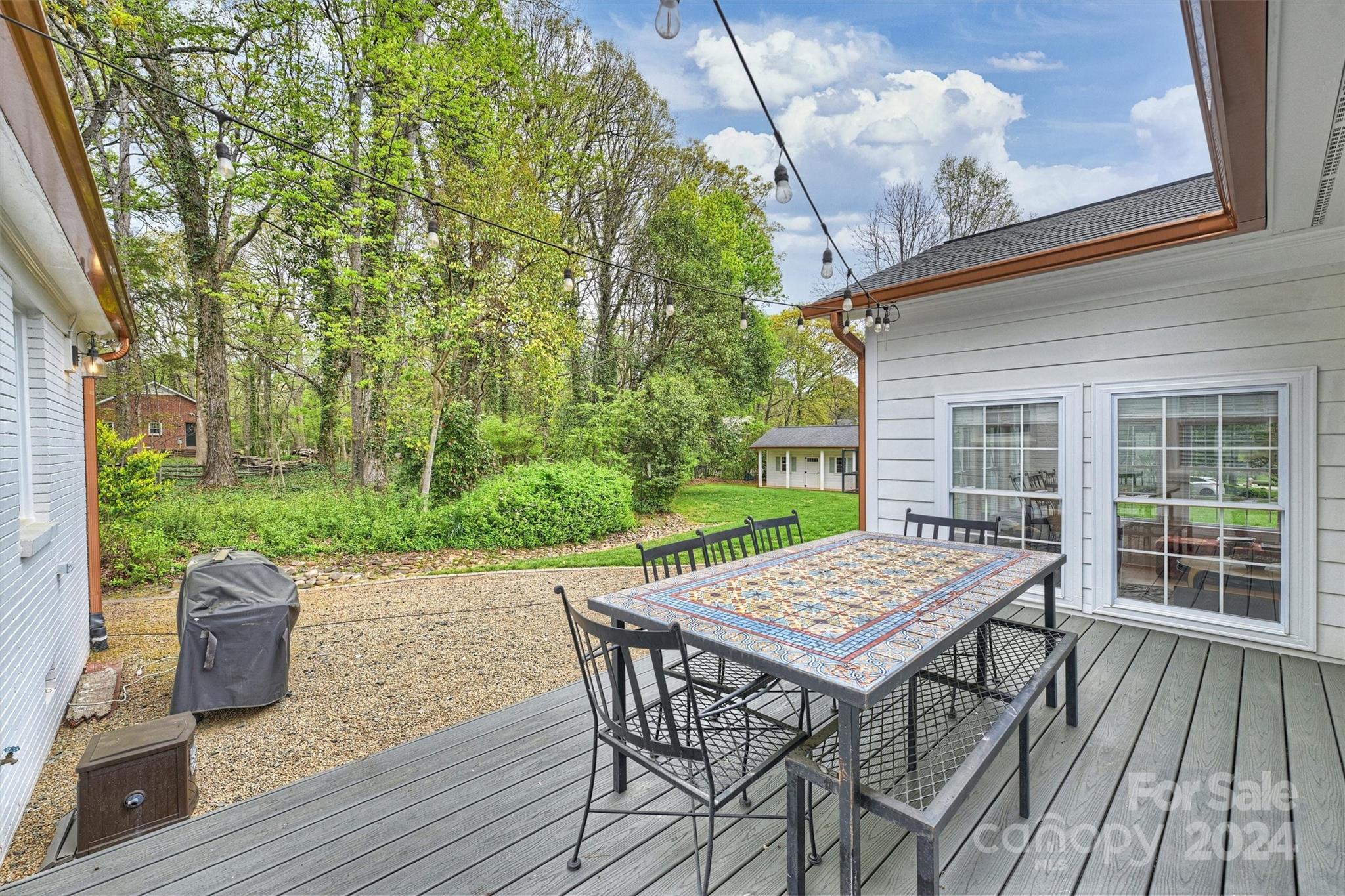 101 Sardis View Road Charlotte, NC 28211 - Photo 33 of 43 a view of a patio with a table and chairs