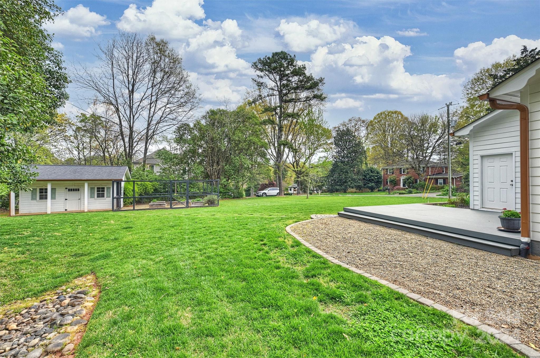101 Sardis View Road Charlotte, NC 28211 - Photo 37 of 43 a view of a house with a big yard and potted plants